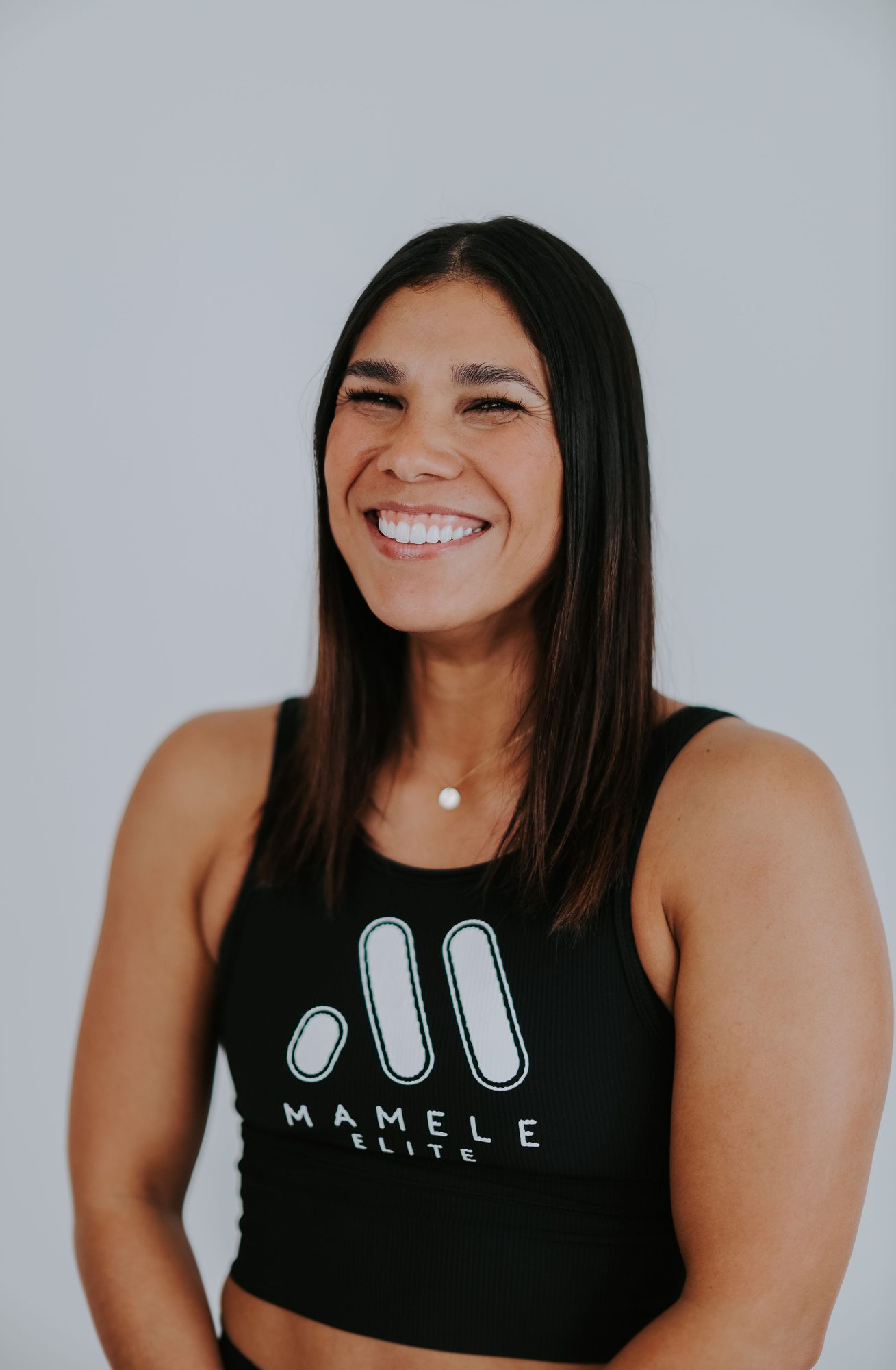 Andrea laughing in a Mamele Elite tank.